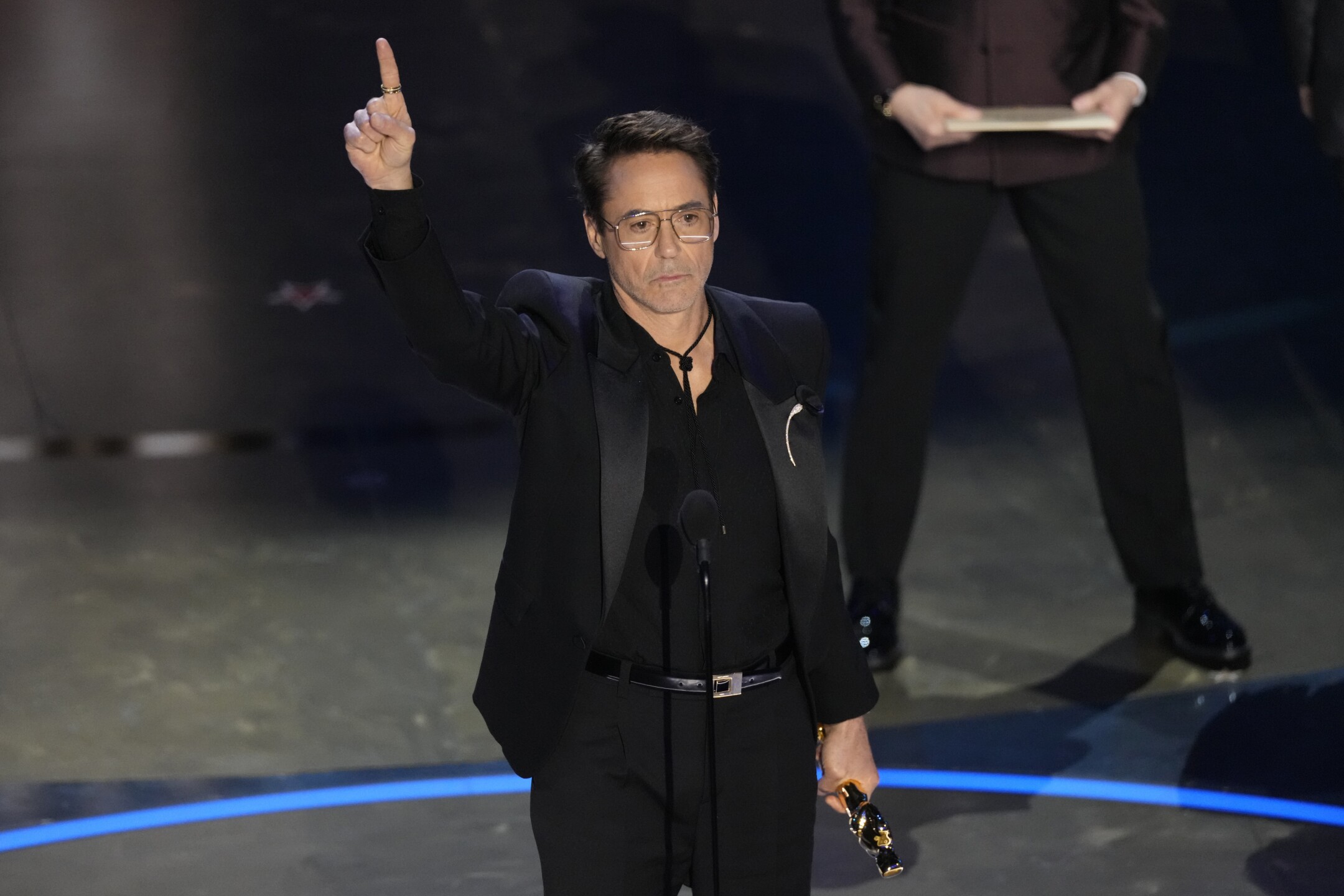 Robert Downey Jr. accepts the award for best performance by an actor in a supporting role for "Oppenheimer" during the Oscars on Sunday, March 10, 2024, at the Dolby Theatre in Los Angeles.