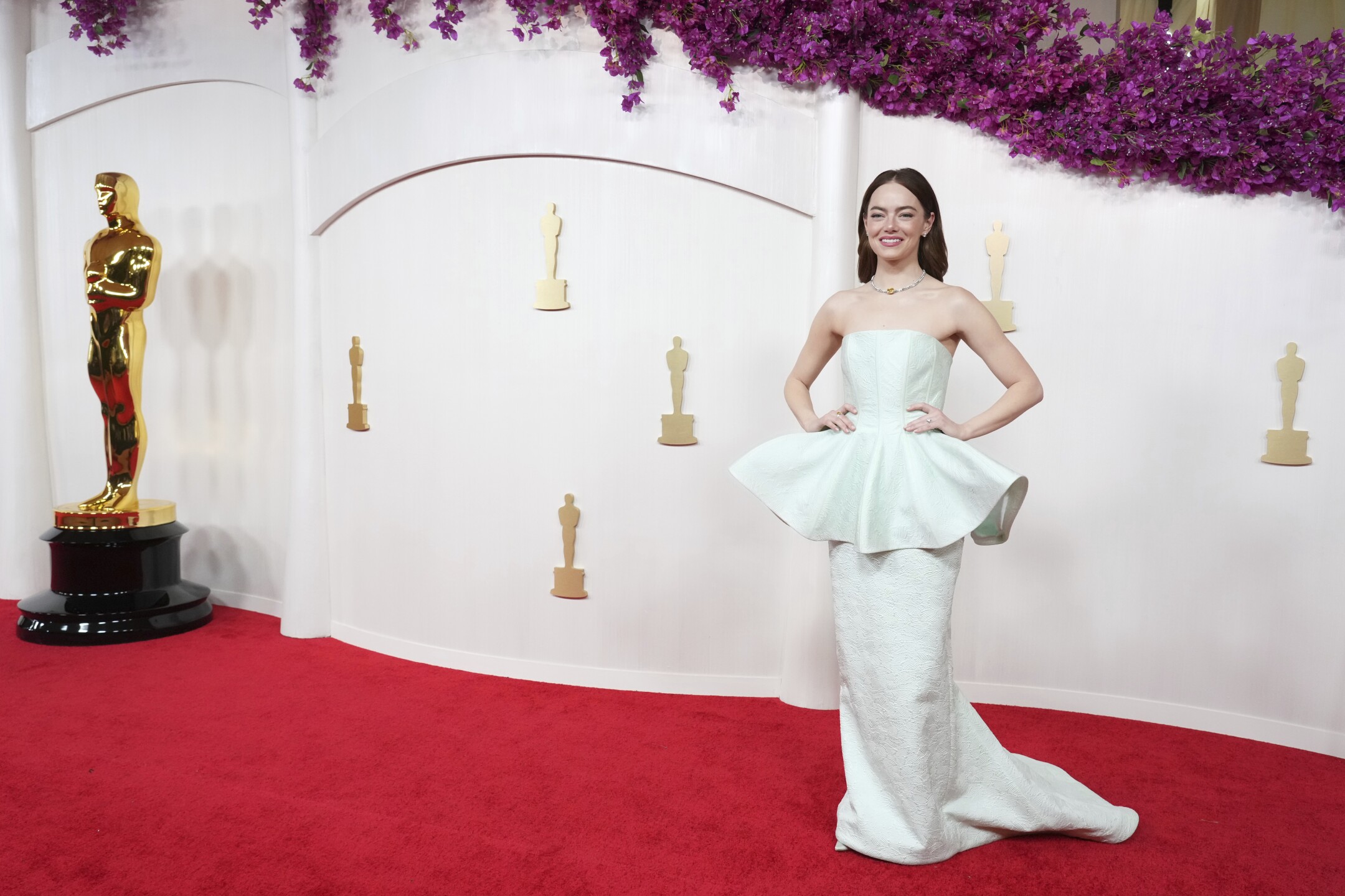 Emma Stone arrives at the Oscars on Sunday, March 10, 2024, at the Dolby Theatre in Los Angeles. 