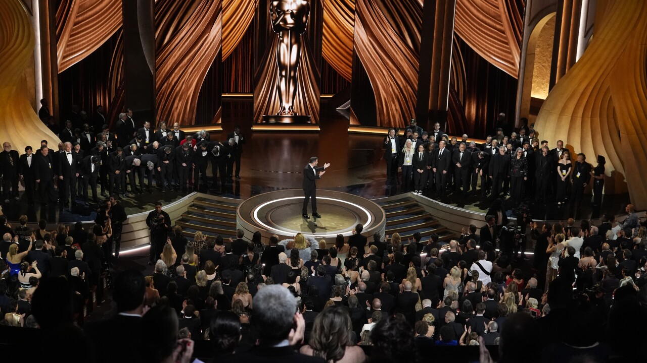 Members of the Oscars crew come out for a round of applause in appreciation for their support during the strike during the Oscars on Sunday, March 10, 2024, at the Dolby Theatre in Los Angeles.