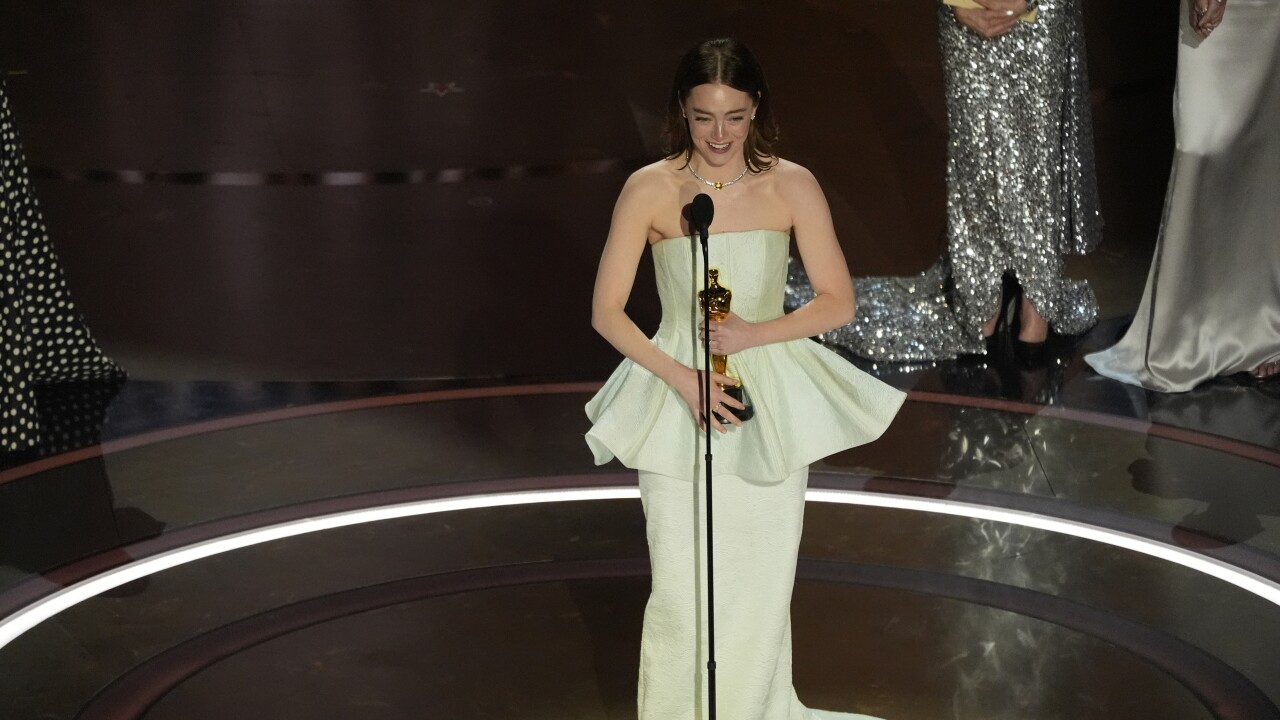 Emma Stone accepts the award for best performance by an actress in a leading role for "Poor Things" during the Oscars on Sunday, March 10, 2024, at the Dolby Theatre in Los Angeles. 