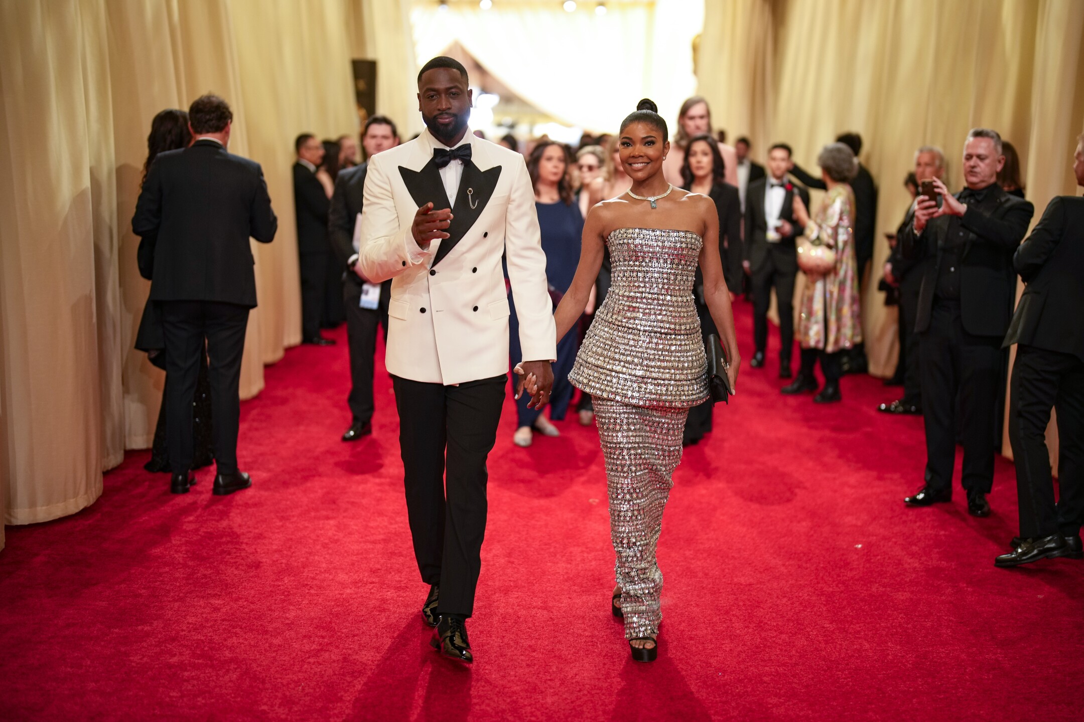 Dwayne Wade, left, and Gabrielle Union arrive at the Oscars on Sunday, March 10, 2024, at the Dolby Theatre in Los Angeles.