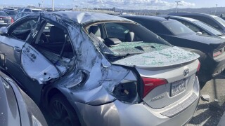 Tire falls off Boeing plane after takeoff, smashes vehicles